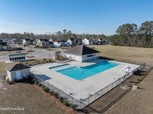 694 Chester Way NE, Leland, NC 28451 - community pool featuring a patio area, an outbuilding, and a residential view
