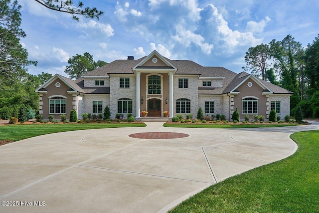 2270 Midland Rd, Pinehurst, NC 28374 - greek revival house featuring a front lawn and curved driveway