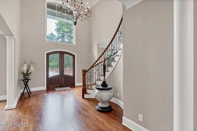 2270 Midland Rd, Pinehurst, NC 28374 - foyer entrance with stairs, wood finished floors, french doors, a chandelier, and a high ceiling