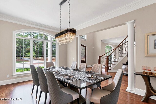 2270 Midland Rd, Pinehurst, NC 28374 - dining room featuring crown molding, stairs, dark wood-style floors, decorative columns, and a chandelier