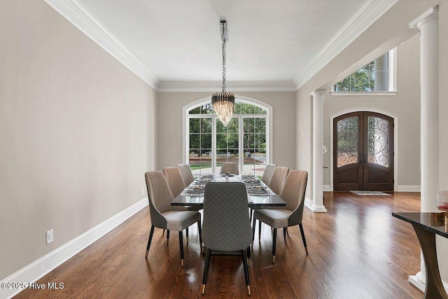 2270 Midland Rd, Pinehurst, NC 28374 - dining area with a chandelier, decorative columns, ornamental molding, wood finished floors, and french doors