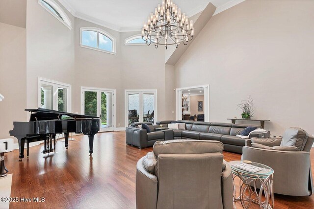 2270 Midland Rd, Pinehurst, NC 28374 - living room with ornamental molding, wood finished floors, a chandelier, and a high ceiling