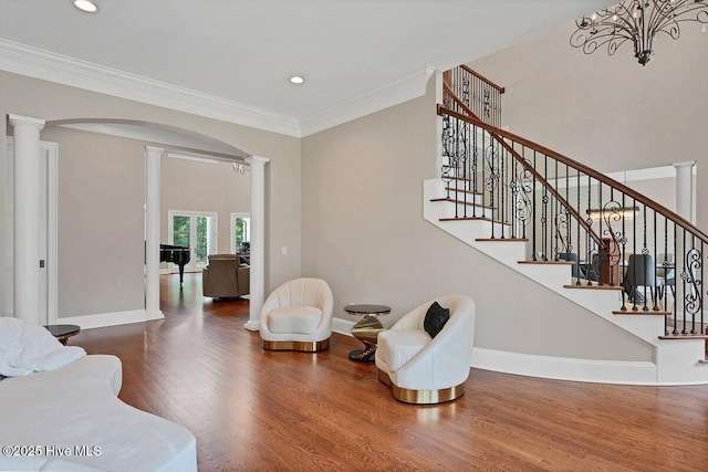 2270 Midland Rd, Pinehurst, NC 28374 - living room featuring decorative columns, wood finished floors, recessed lighting, ornamental molding, and stairway
