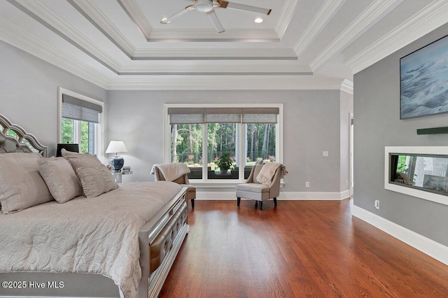 2270 Midland Rd, Pinehurst, NC 28374 - bedroom with a tray ceiling, dark wood-type flooring, and crown molding