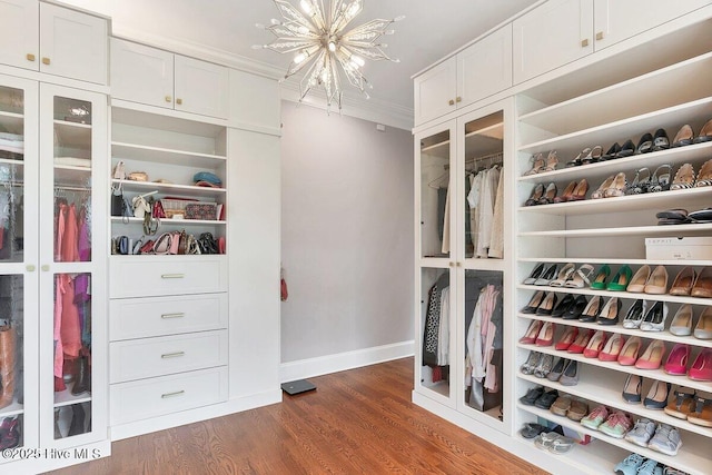 2270 Midland Rd, Pinehurst, NC 28374 - walk in closet featuring a chandelier and dark wood finished floors
