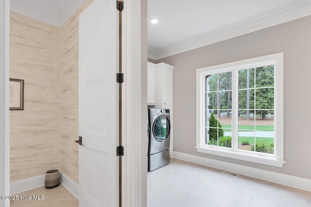 2270 Midland Rd, Pinehurst, NC 28374 - washroom with washer / clothes dryer, cabinet space, healthy amount of natural light, crown molding, and light tile patterned flooring