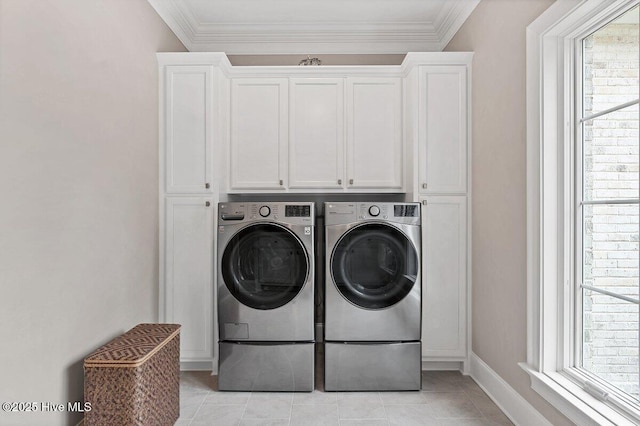 2270 Midland Rd, Pinehurst, NC 28374 - washroom featuring washing machine and dryer, healthy amount of natural light, crown molding, cabinet space, and light tile patterned floors