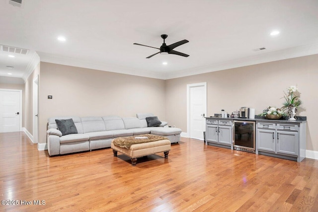 2270 Midland Rd, Pinehurst, NC 28374 - living area featuring wine cooler, ceiling fan, crown molding, light wood-style flooring, and recessed lighting