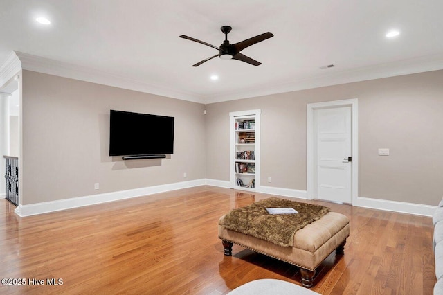 2270 Midland Rd, Pinehurst, NC 28374 - living area with crown molding, ceiling fan, light wood-style floors, recessed lighting, and built in features