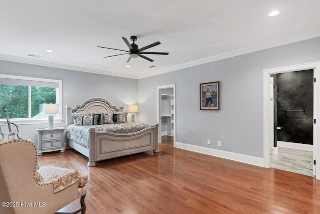 2270 Midland Rd, Pinehurst, NC 28374 - bedroom with wood finished floors, crown molding, recessed lighting, a walk in closet, and ceiling fan