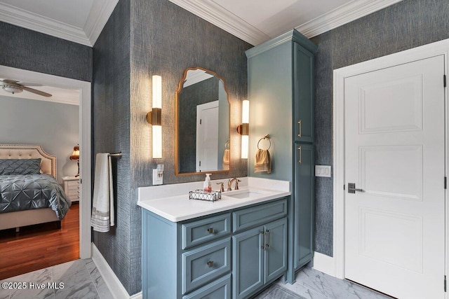 2270 Midland Rd, Pinehurst, NC 28374 - ensuite bathroom with ornamental molding, marble look tile flooring, vanity, a ceiling fan, and wallpapered walls