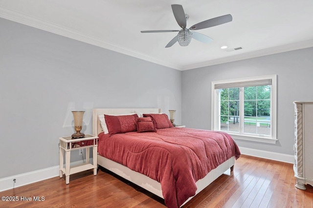2270 Midland Rd, Pinehurst, NC 28374 - bedroom with wood finished floors, crown molding, recessed lighting, and ceiling fan