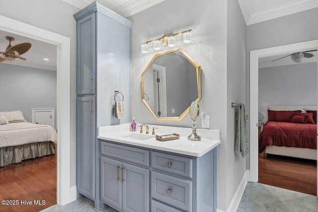 2270 Midland Rd, Pinehurst, NC 28374 - ensuite bathroom featuring ornamental molding, vanity, ceiling fan, and wood finished floors