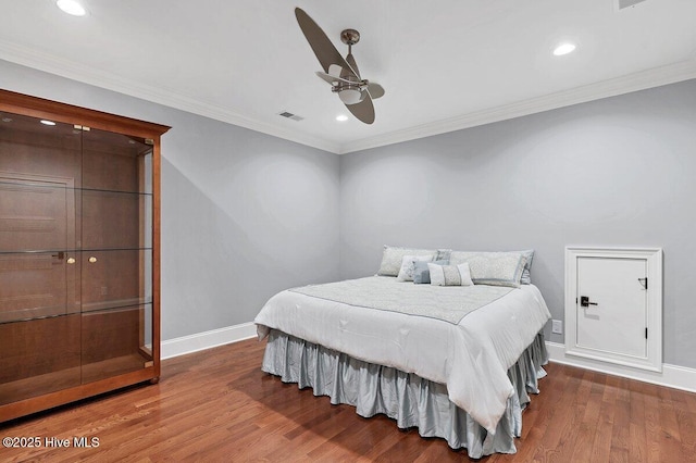 2270 Midland Rd, Pinehurst, NC 28374 - bedroom with wood finished floors, recessed lighting, ornamental molding, and a ceiling fan