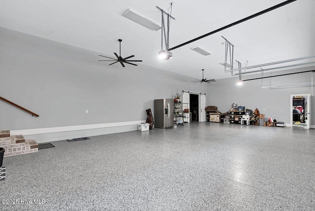 2270 Midland Rd, Pinehurst, NC 28374 - garage with ceiling fan and stainless steel refrigerator with ice dispenser