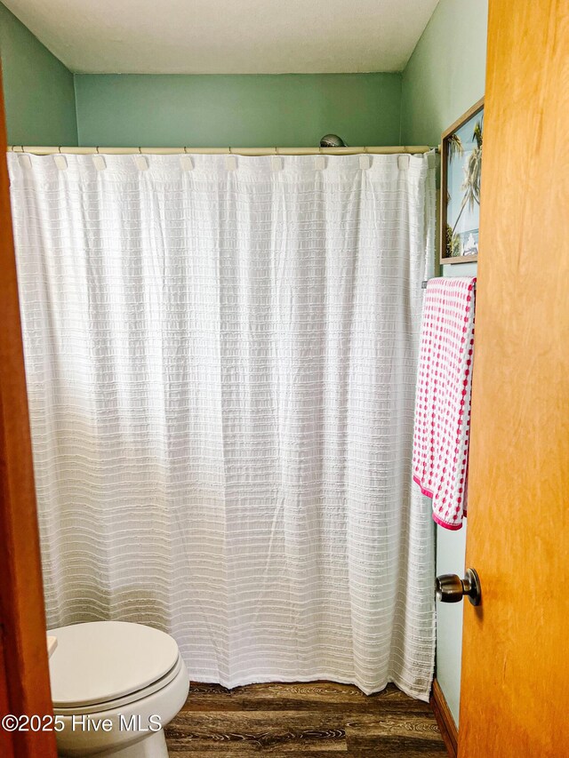 4704 S Va Dare Trl, Nags Head, NC 27959 - full bath with wood finished floors and a shower with curtain