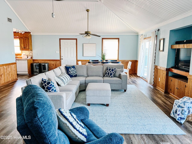 4704 S Va Dare Trl, Nags Head, NC 27959 - living area featuring wainscoting, vaulted ceiling, healthy amount of natural light, wooden walls, and wood finished floors