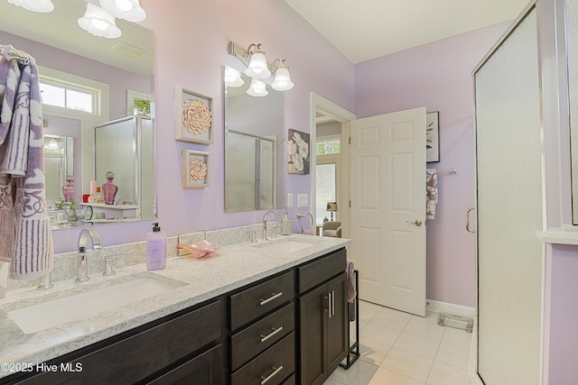 1209 Moultrie Dr NW, Calabash, NC 28467 - bathroom with a shower stall, tile patterned floors, double vanity, and baseboards