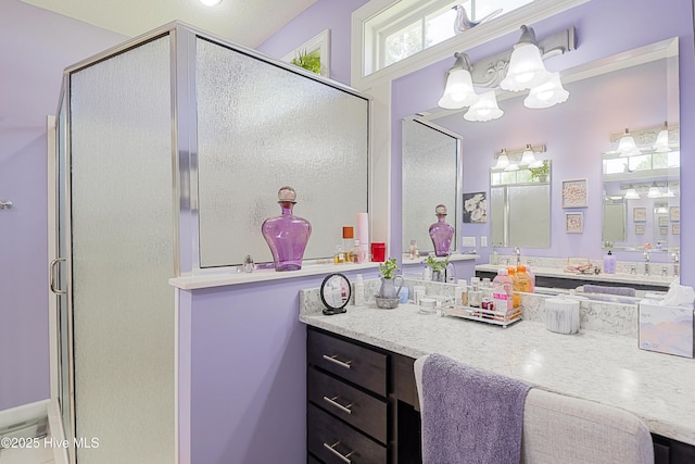 1209 Moultrie Dr NW, Calabash, NC 28467 - full bath with a shower stall, vanity, and a chandelier