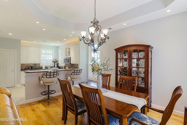 1209 Moultrie Dr NW, Calabash, NC 28467 - dining room featuring recessed lighting, light wood-style flooring, and a chandelier