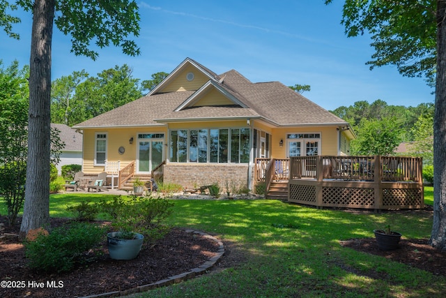 1209 Moultrie Dr NW, Calabash, NC 28467 - back of property with a wooden deck, entry steps, a yard, and a patio
