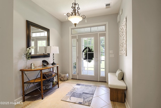 1209 Moultrie Dr NW, Calabash, NC 28467 - tiled entrance foyer featuring healthy amount of natural light and baseboards