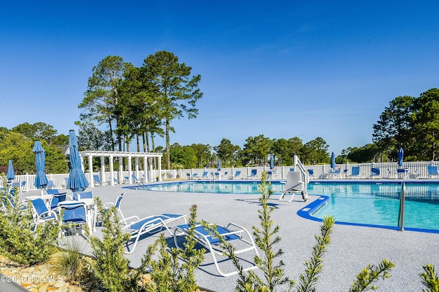 1209 Moultrie Dr NW, Calabash, NC 28467 - community pool featuring a pergola and a patio