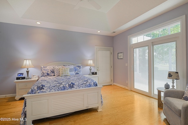 1209 Moultrie Dr NW, Calabash, NC 28467 - bedroom featuring access to exterior, light wood-type flooring, recessed lighting, baseboards, and a tray ceiling