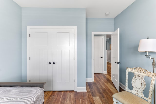 8116 Barstow Ln, Wilmington, NC 28411 - bedroom featuring dark wood-type flooring and a closet