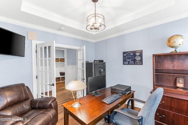 8116 Barstow Ln, Wilmington, NC 28411 - office featuring wood finished floors, a chandelier, ornamental molding, french doors, and a tray ceiling