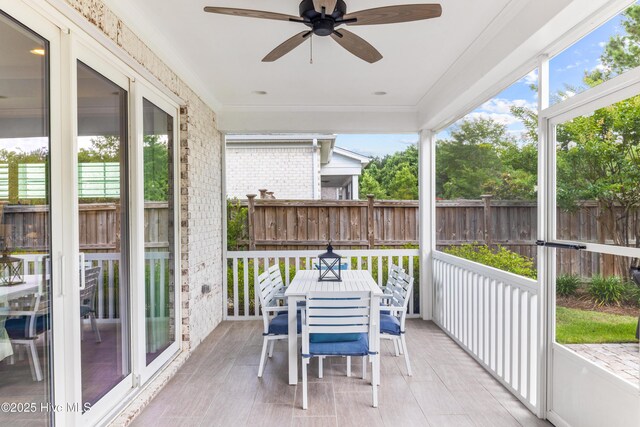 8116 Barstow Ln, Wilmington, NC 28411 - sunroom with outdoor dining area, ceiling fan, and healthy amount of natural light
