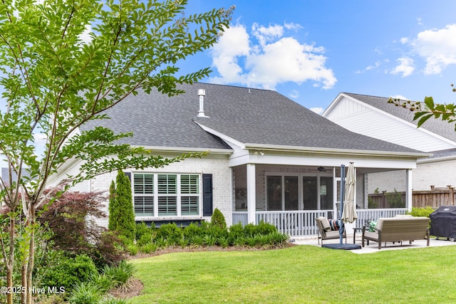 8116 Barstow Ln, Wilmington, NC 28411 - rear view of property with a ceiling fan, brick siding, a patio area, roof with shingles, and an outdoor hangout area