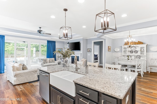 8116 Barstow Ln, Wilmington, NC 28411 - kitchen featuring dishwasher, open floor plan, a chandelier, crown molding, and hanging light fixtures