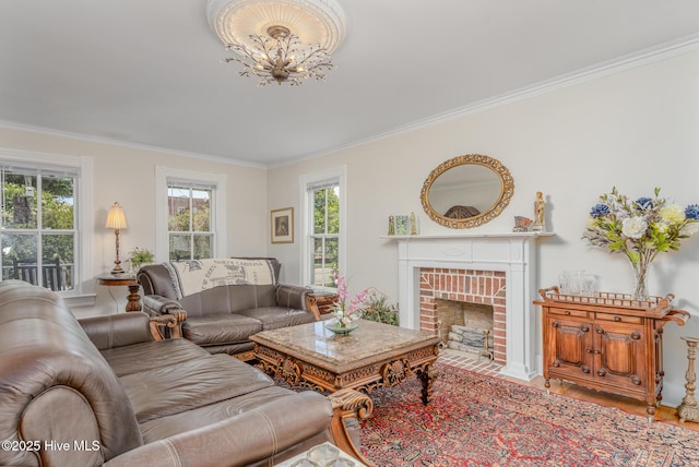 405 Hancock St, New Bern, NC 28560 - living room with ornamental molding, healthy amount of natural light, a fireplace, wood finished floors, and a chandelier