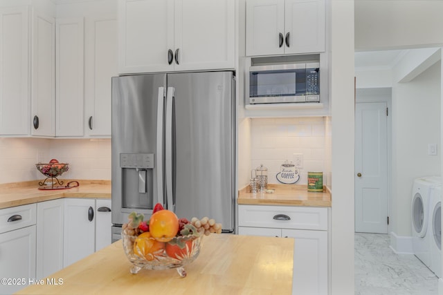 405 Hancock St, New Bern, NC 28560 - kitchen featuring butcher block countertops, appliances with stainless steel finishes, washer and clothes dryer, white cabinets, and crown molding