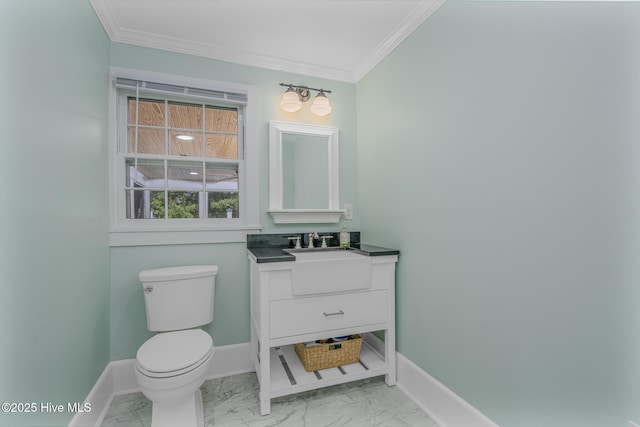 405 Hancock St, New Bern, NC 28560 - bathroom featuring vanity, marble look tile flooring, crown molding, toilet, and baseboards