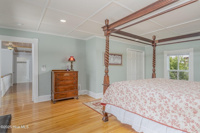 405 Hancock St, New Bern, NC 28560 - bedroom featuring light wood finished floors, a closet, coffered ceiling, and ornamental molding