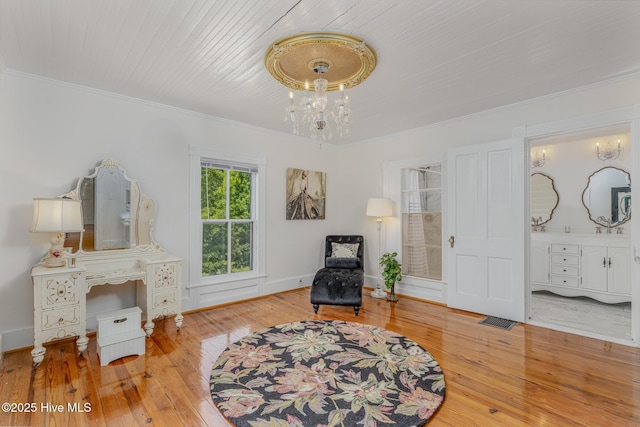 405 Hancock St, New Bern, NC 28560 - sitting room with hardwood / wood-style floors, crown molding, and a chandelier