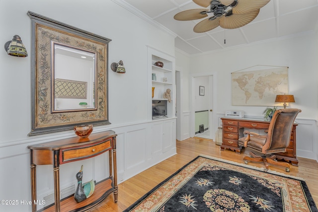 405 Hancock St, New Bern, NC 28560 - office area with built in shelves, ceiling fan, light wood finished floors, ornamental molding, and a wainscoted wall