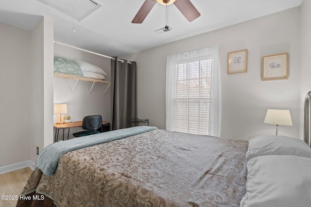 415 Greenville Ave Unit A, Carolina Beach, NC 28428 - bedroom with attic access, wood finished floors, a ceiling fan, and an office area