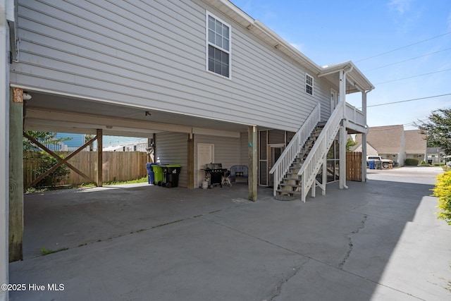 415 Greenville Ave Unit A, Carolina Beach, NC 28428 - view of side of home with a carport and stairs