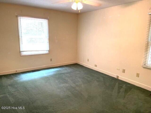 105 Ridgewood Rd, Pinehurst, NC 28374 - empty room featuring a ceiling fan and dark carpet