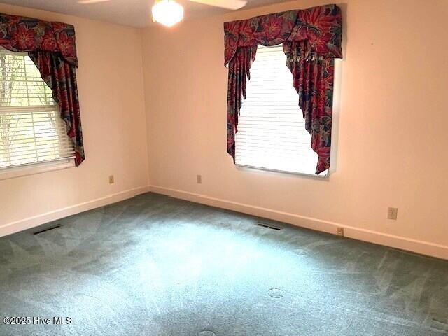 105 Ridgewood Rd, Pinehurst, NC 28374 - carpeted spare room featuring baseboards and ceiling fan