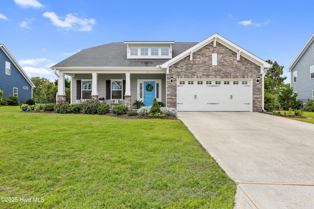 444 Island End Ct, Wilmington, NC 28412 - craftsman house featuring an attached garage, driveway, a front yard, and stone siding