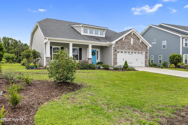 444 Island End Ct, Wilmington, NC 28412 - craftsman house with a garage, concrete driveway, stone siding, and a front lawn