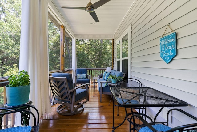 322 NE 42nd St, Oak Island, NC 28465 - porch with a ceiling fan and an outdoor living space