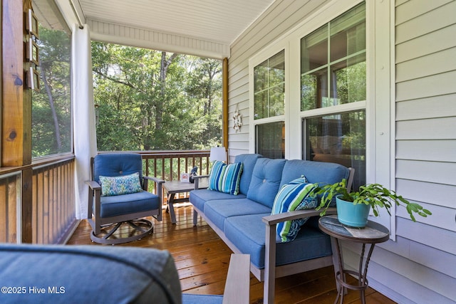 322 NE 42nd St, Oak Island, NC 28465 - sunroom / solarium featuring an outdoor living space
