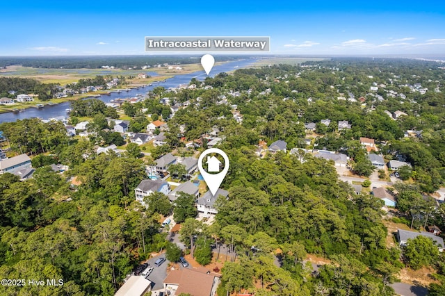 322 NE 42nd St, Oak Island, NC 28465 - aerial overview of property's location with a large body of water and nearby suburban area