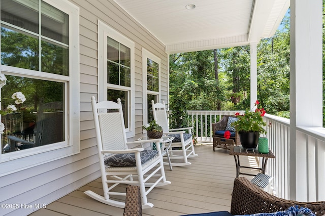 322 NE 42nd St, Oak Island, NC 28465 - view of wooden porch