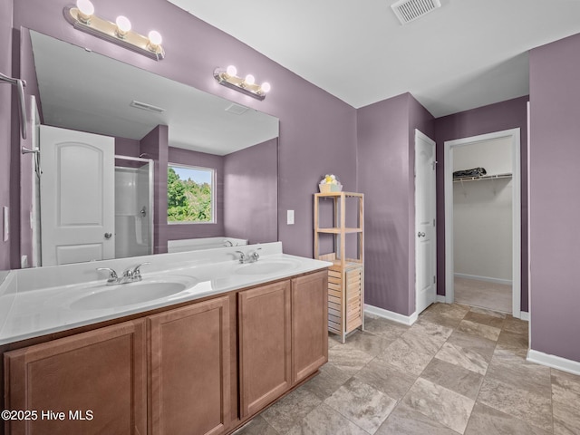 301 Stella Bridgeway Dr, Stella, NC 28582 - full bathroom featuring a shower stall, double vanity, and a walk in closet